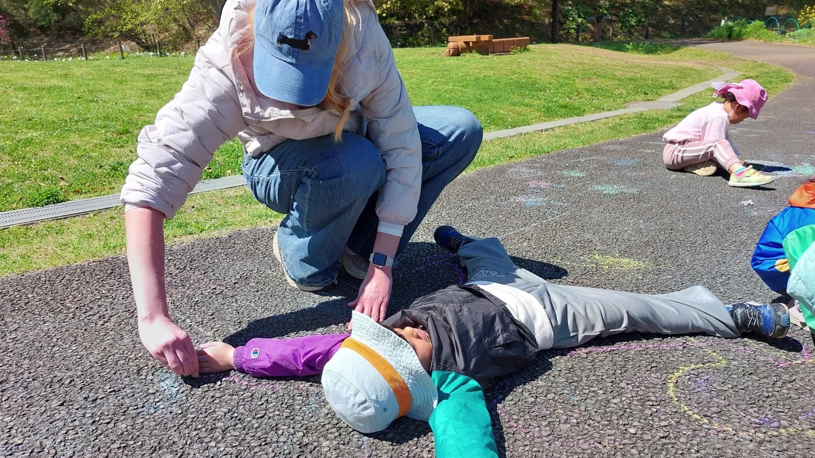 Tracing a child's outline in chalk