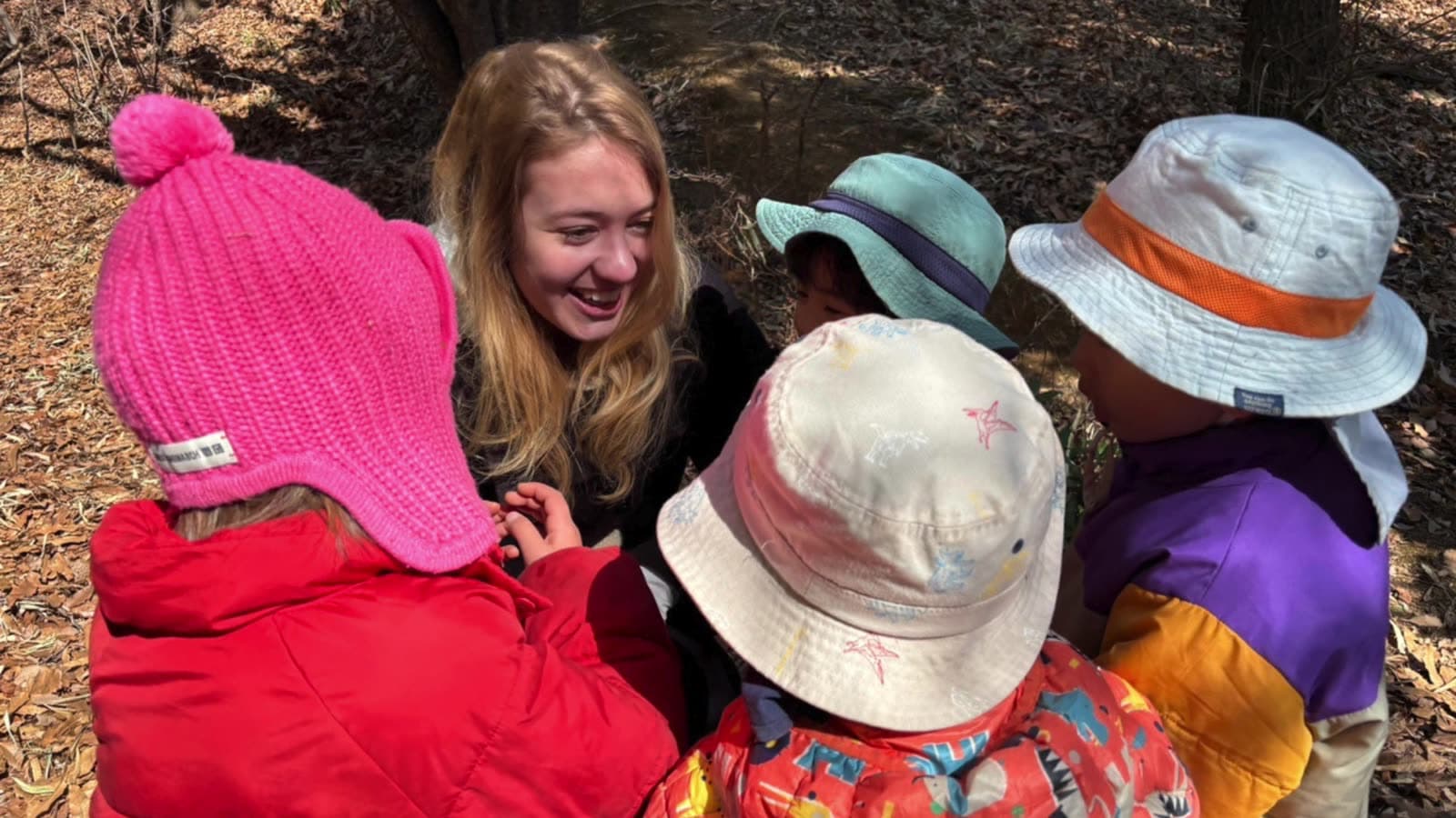 Laughing with children in the forest
